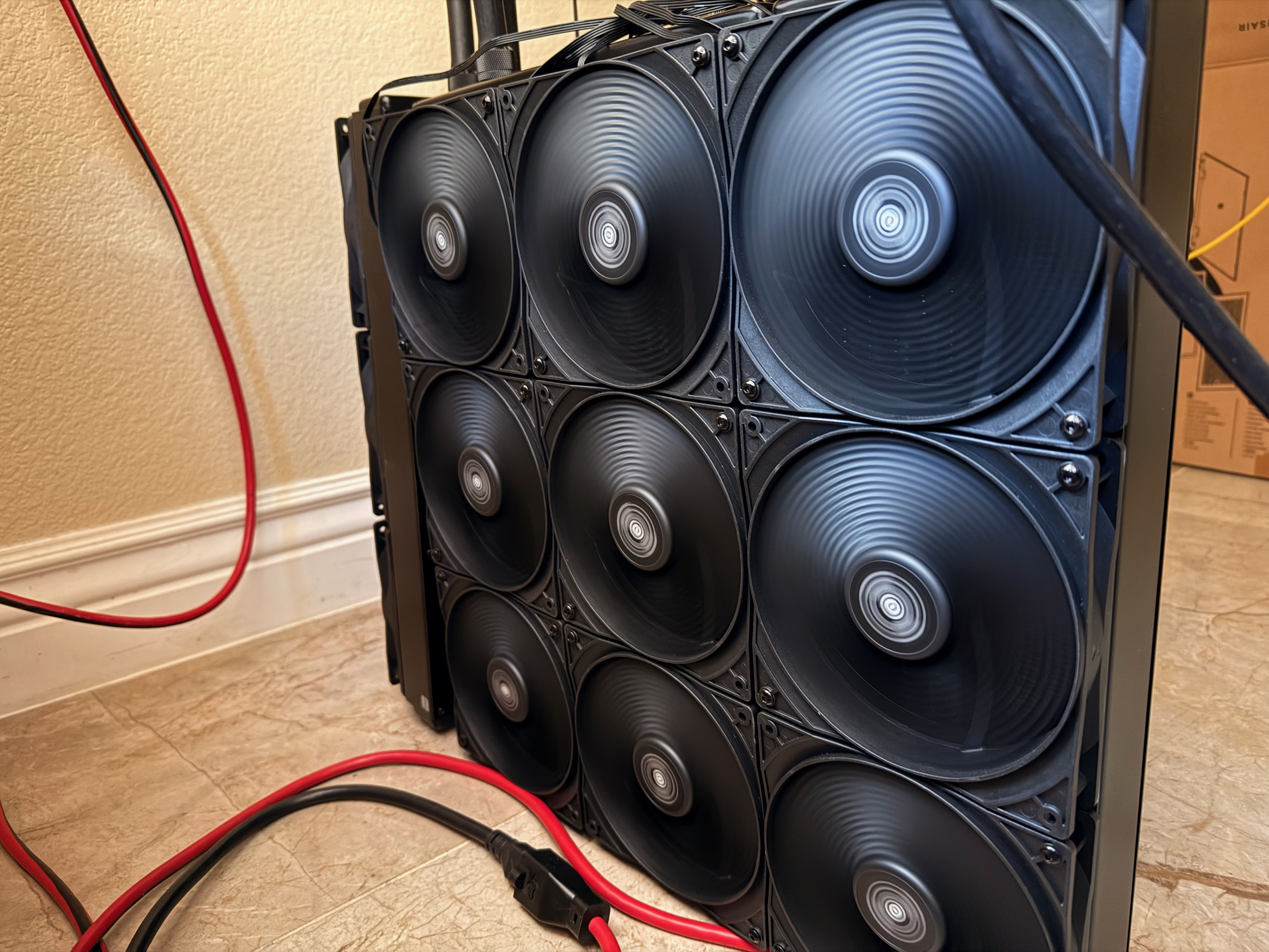 One of the two Alphacool XT45 1260 mm radiators — 3×3 grid of 140 mm fans